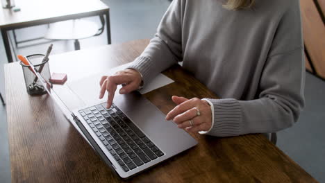 student using computer in classroom