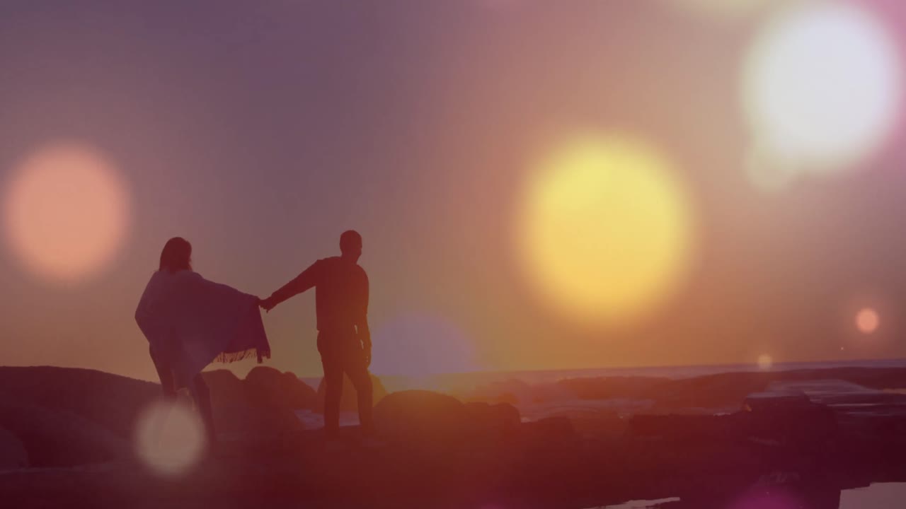 손을 잡고 있는 다양한 커플 위에 반 ⁇ 이는 반점의 애니메이션