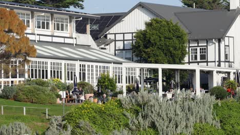 guests dining and relaxing in lush hotel garden