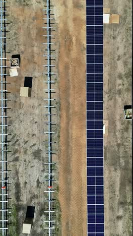 solar panels field under construction, aerial top down view