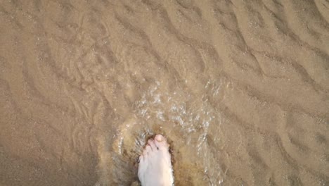 walking barefoot across the beach