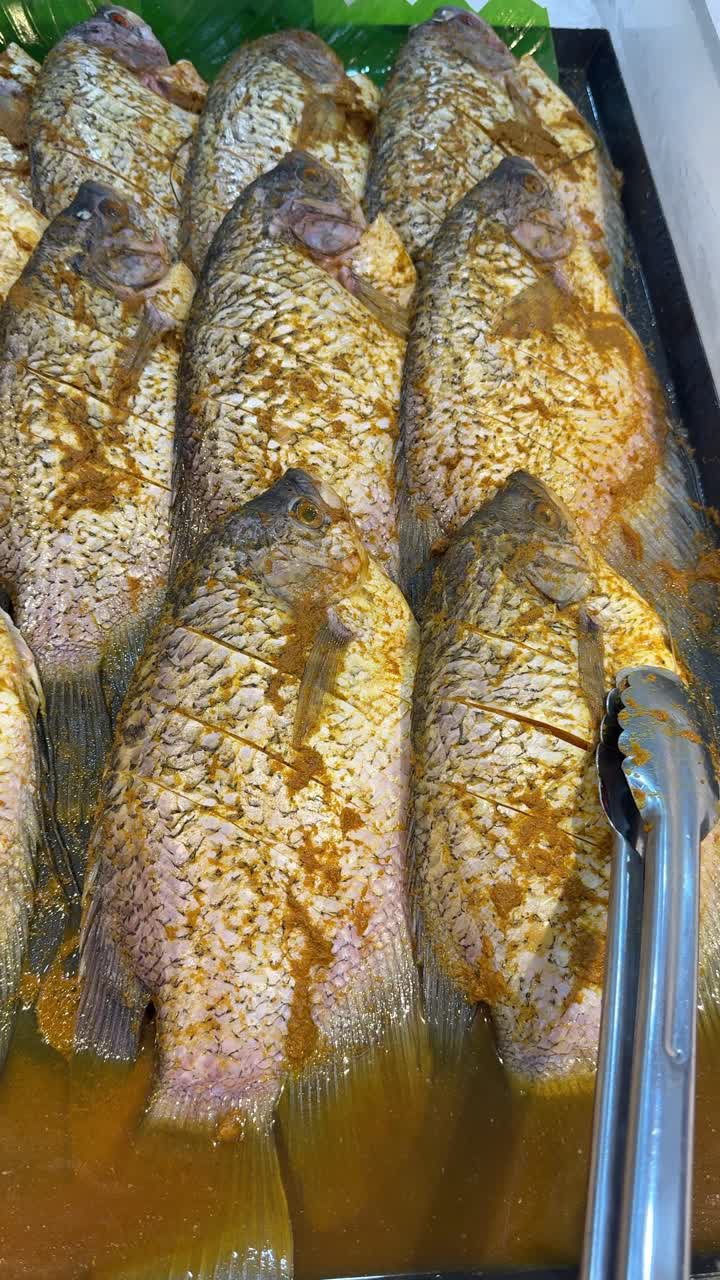 Marinated Whole Fish Ready for Cooking in a Tray