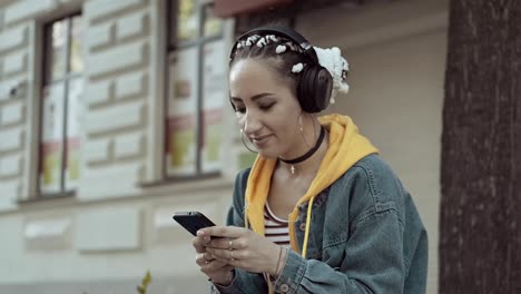 joyful young woman listening to music wear earphone. social network concept