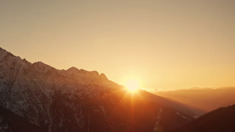 picturesque warm sunset over italian alps in wintertime