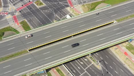 top view over the highway, expressway and motorway, aerial view interchange with car driving down the highway