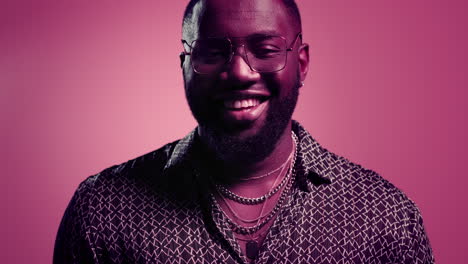 african american man smiling at camera in studio. disco guy posing on camera