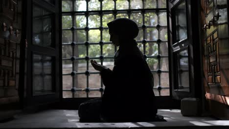 muslim woman silhouette in mosque