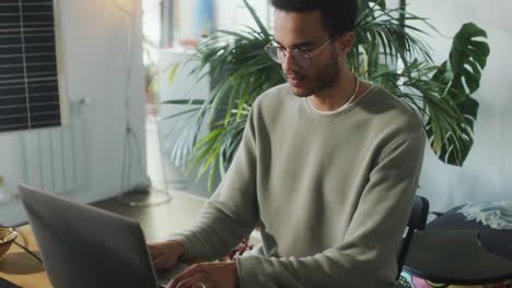 man installing solar panel in home office