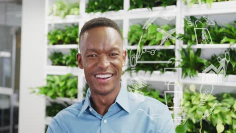 animation of globe with data processing over african american businessman in office