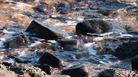 Waves splashing over rocks at Brighton Beach