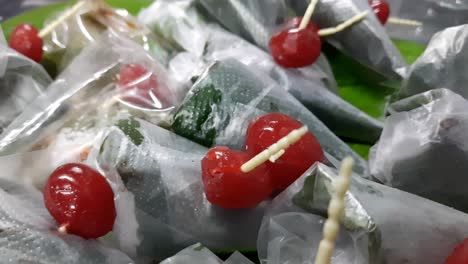 Closeup-footage-of-sweet-masala-Paan,-a-preparation-combining-betel-leaf-with-areca-nut,-tobacco-widely-consumed-throughout,-Southeast-Asia,-India,-and-Taiwan-as-a-mouth-freshener-after-a-meal