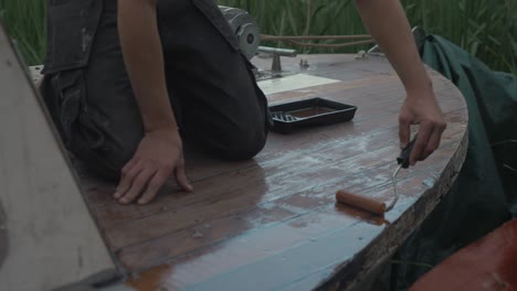 Rolling-on-varnish-bow-deck-boat-restoration