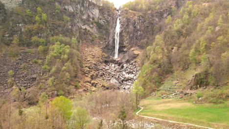 cascade falls down on rock boulders in foroglio, bavona valley, north of locarno in southern switzerland