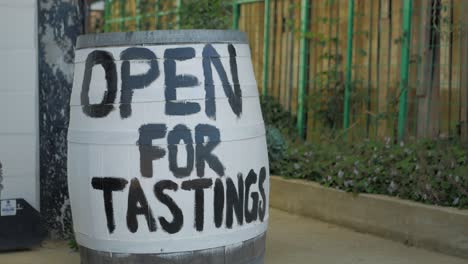 Repurposed-wine-barrel-with-'Open-For-Tastings'-signage