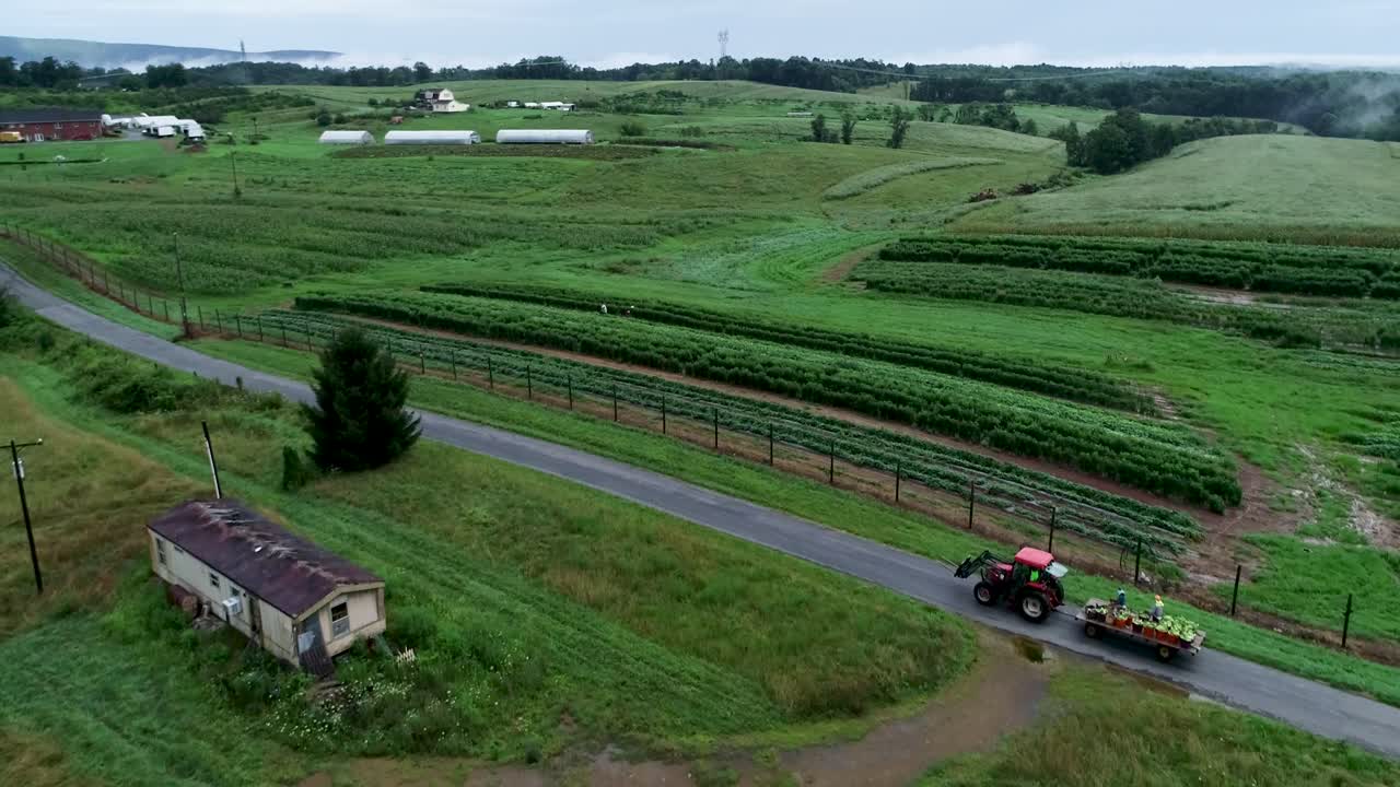 Aerial View of a Farm with Tractor on a Road