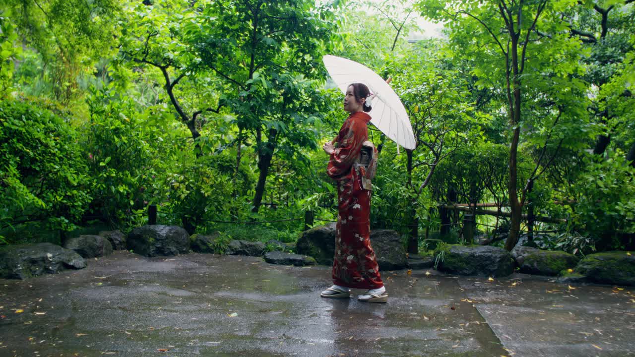 Woman in Kimono in a Rainy Japanese Garden