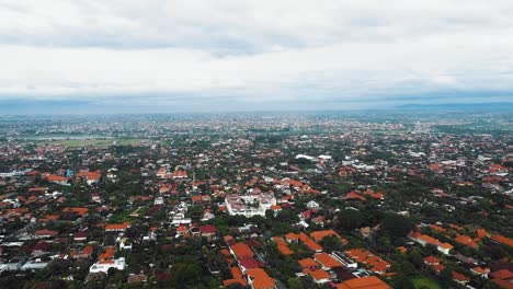 Beautiful-cinematic-Sanur-beach,-Bali-drone-footage-with-interesting-landscape,-fishing-boats,-village-houses-and-calm-weather