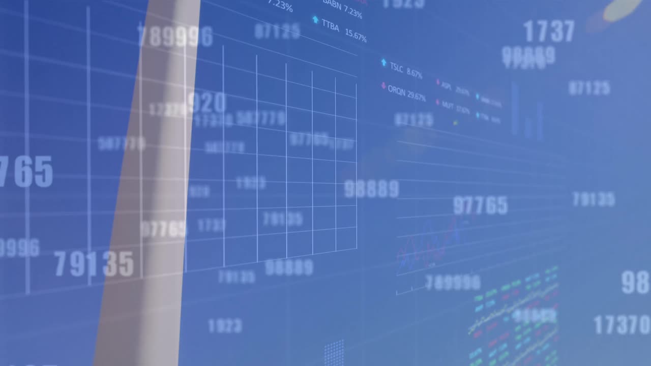 Animation of multiple changing numbers over male engineer taking picture of the windmill