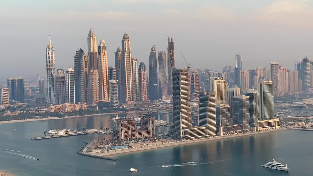 Dubai Marina's skyscrapers framing the skyline, with boats gracefully navigating the waters