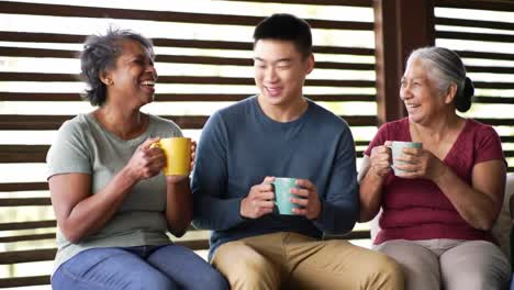 a joyful gathering: three friends sharing laughter and warmth over coffee in a cozy setting, emphasizing connection, happiness, and cherished moments together