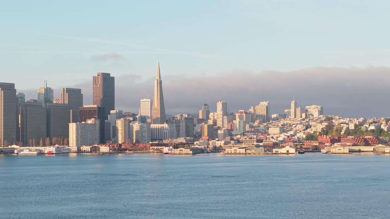The organized density of downtown contrasts beautifully with the soft movement of the bay in this bird’s-eye view.