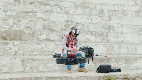 A-Man-Pilots-A-Drone-In-A-Helmet-With-A-Video-Screen-First-Person-Sports-Piloting