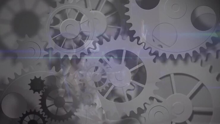 Animation of network of cogs spinning over data processing