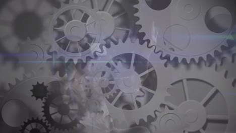 animation of network of cogs spinning over data processing