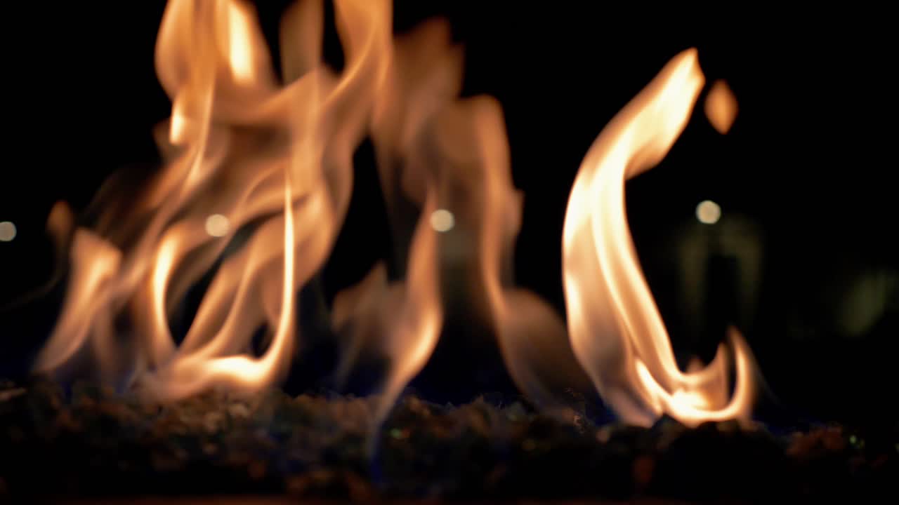 Fire On Burning Coals In The Dark During The Night - Flames - Elemental - Close Up Shot