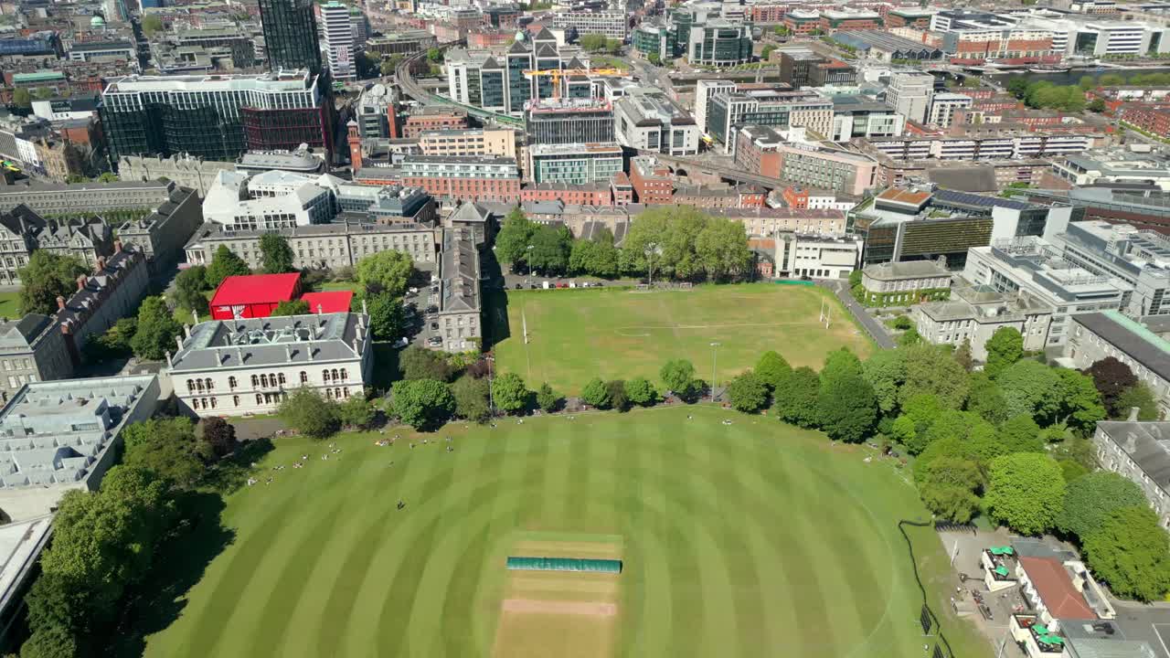 Wide advancing aerial video of the campus and surrounding areas of Trinity College in Dublin, Ireland on a sunny day. Filmed in 4K, 60FPS and with Rec709 color.