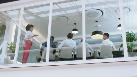 group of business people meeting in boardroom team leader woman presenting ideas on whiteboard discussing strategy with colleagues in office training presentation 4k