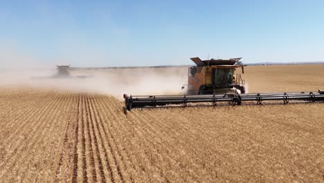 This-footage-captures-the-synergy-of-modern-agricultural-technology,-showcasing-the-essential-role-of-header-fronts-in-the-wheat-harvesting-process