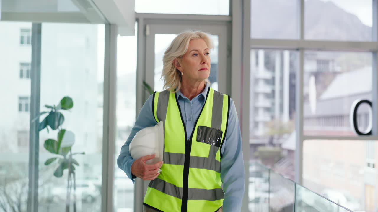 Woman engineer in a safety vest and hard hat