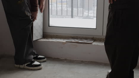 couple choosing floor tiles for home renovation