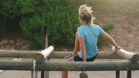 Caucasian-woman-exercising-at-bootcamp