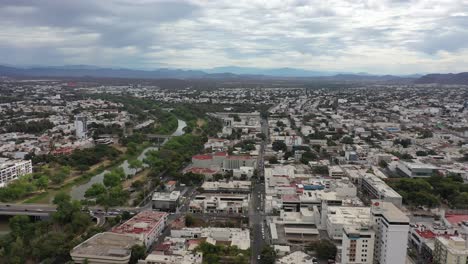 Culiacan-sinaloa-city,-wide-view-from-sky,-tres-rios-river-and-downtown-city-from-the-sky-drone-view-4k,-Mexico-republic,-ciudad-de-culiacan-sinaloa-desde-el-cielo-con-toma-de-dron-4k