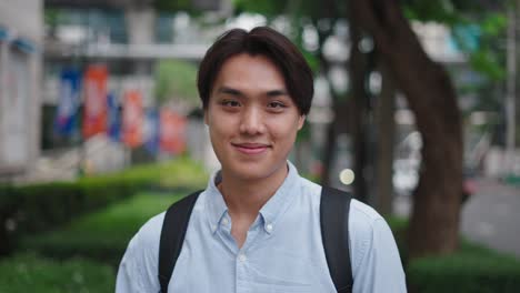 young asian man in city