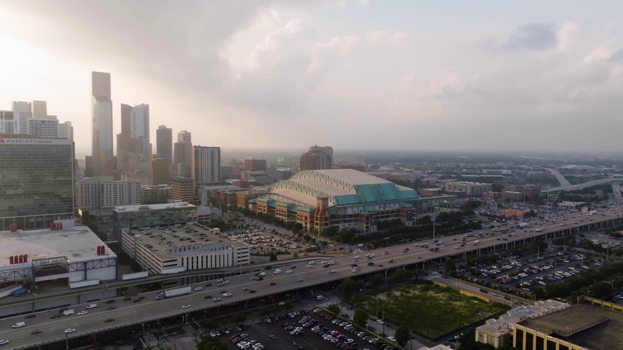 Drone rotating in front of the Minute maid park, hazy sunset in Houston, USA
