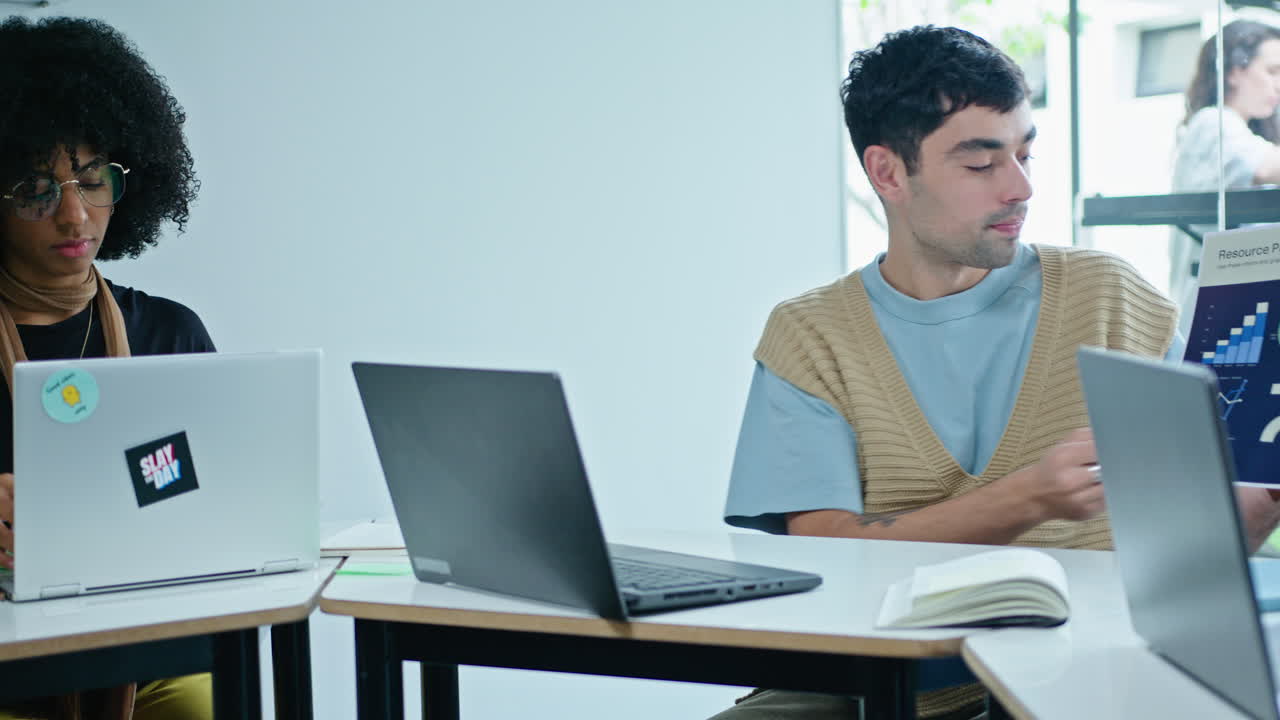 Young Business People Chatting when Having Coffee Break on Balcony