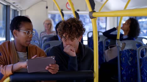 couple interacting with each other while using digital tablet 4k