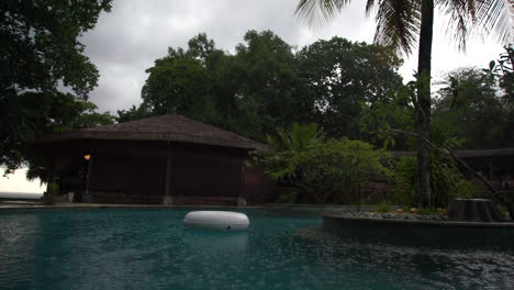 Inner-tube-in-pool-during-rainy-day