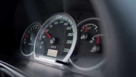 close-up of a car dashboard with a speedometer showing a speed of 60 km per hour