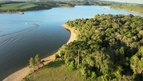 Orbital-drone-view-at-a-lake-with-summer-leisure-activities