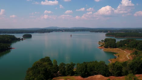 droning over lake lanier in georgia with mountains in the background