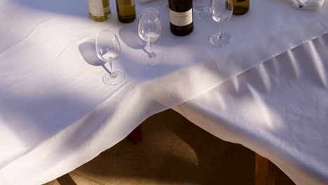 wine bottles and glasses on a table