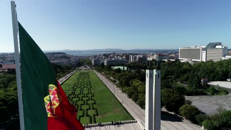 giant portugal flag winding in portuguese city capital