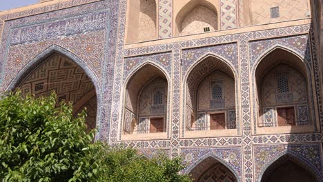 rows of archways in historic madrassa in samarkand, uzbekistan along the historic silk road