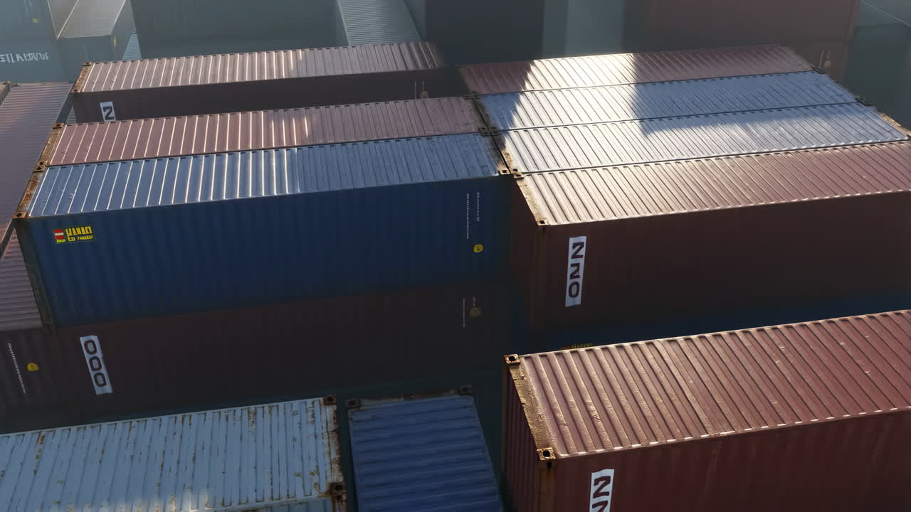 Rows of stacked shipping containers at a port