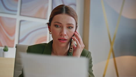 mad designer calling colleague nervous conversation office closeup. ceo arguing