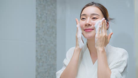 woman washing her face